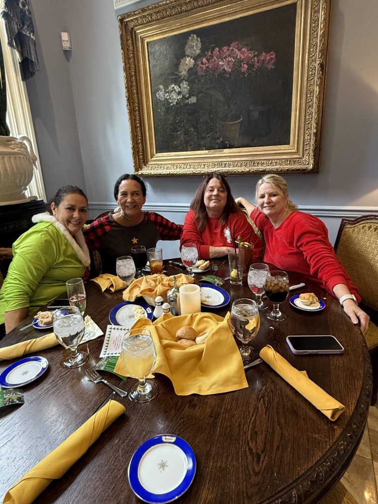 a group of people sitting at a table