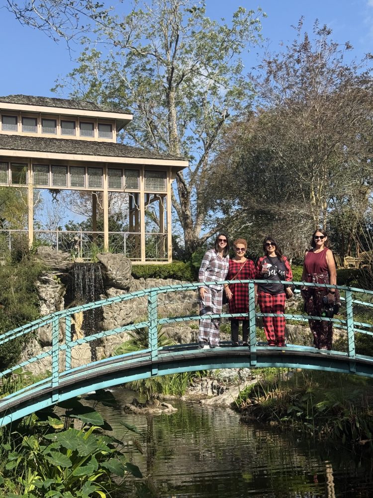 a group of people standing on a bridge