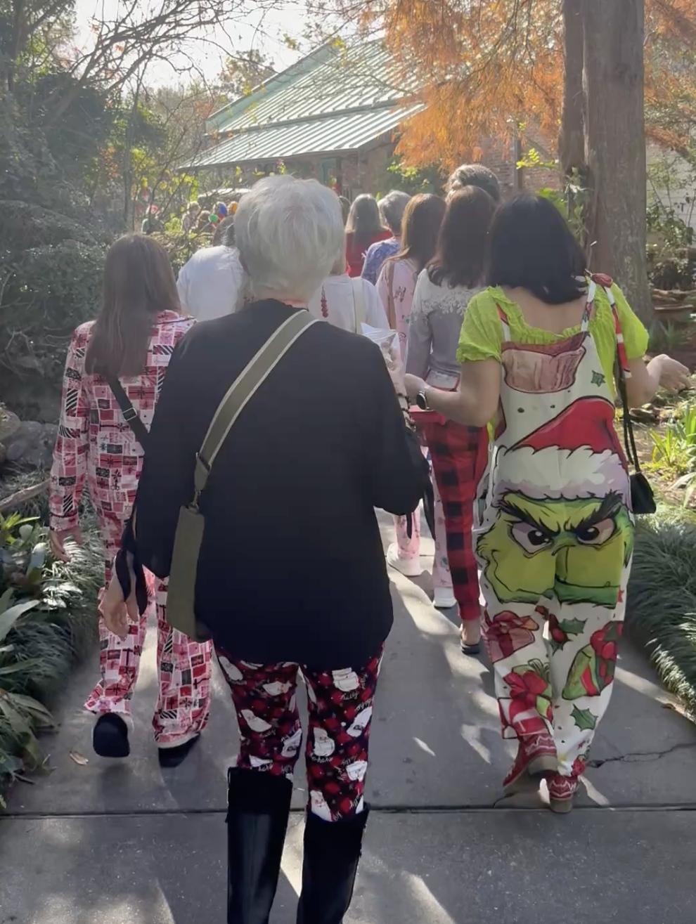 a group of people walking down a street